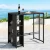Gardeon Outdoor Wicker Bar Table: Steel Frame, Glass Top, 3 Shelves, Footrest, Black, 103.5x62x104.5cm,